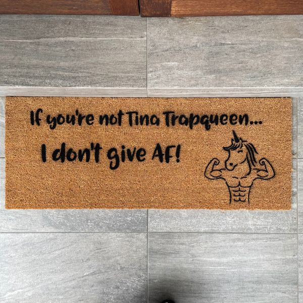 Doormat that says If you're not Tina Trapqueen... I don't give AF with a picture of a muscly unicorn