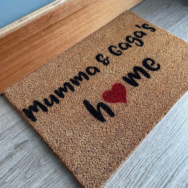 Doormat that says Mumma & Gaga's home with a red heart