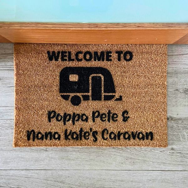 Doormat that says Welcome to Poppa Pete & Nana Kate's Caravan